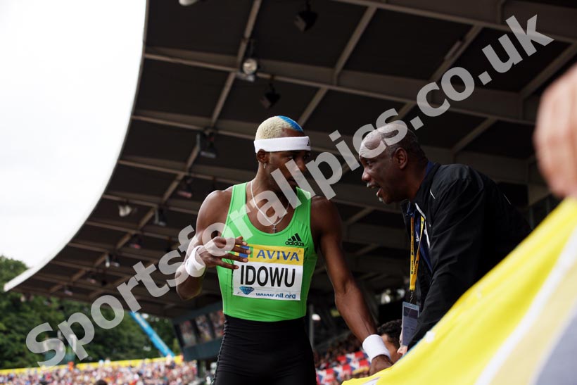 Triple Jumper Phillips Idowu is given advice by his coach Aston Moore, 2011 Aviva London Grand Prix